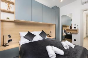 a bedroom with a large bed with towels on it at Villa Vela in Brzac +37 photos