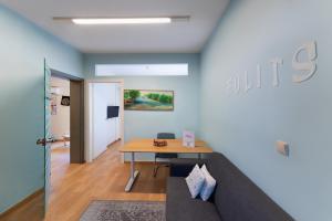 a living room with a table and a couch at Folitsa happy central home in Rhodes Town