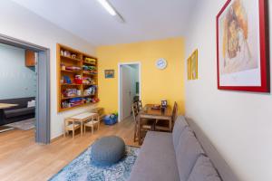 a living room with a couch and a table at Folitsa happy central home in Rhodes Town +7 photos