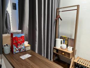 a dressing table with a mirror and a dresser with a dresser at Choco village 126A in Xã Thang Tam