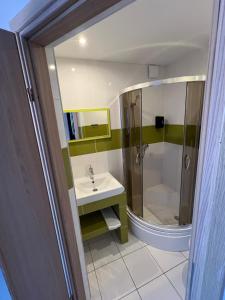 a bathroom with a shower and a sink at pokoje gościnne u znajomej in Darłowo +60 photos