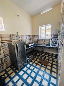 a kitchen is being remodeled with a refrigerator at Babuloos Homestay in Varkala