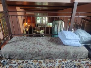 a large bed in a room with at Anastasia's Cottage in Oikhalía