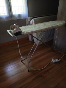 a table in a room with a phone on it at Maison au pied du château, terrasse in Grignan