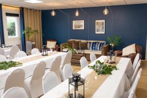 a room with white tables and white chairs at Best Western Bridge Hotel Lyon East in Jons +129 photos