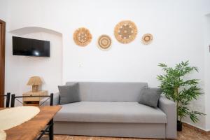 a living room with a couch and a table at The Stone Nest in Kefalos
