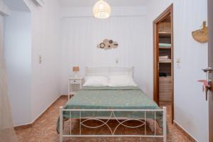 a bedroom with a bed in a room at The Stone Nest in Kefalos