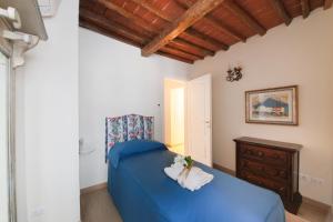 Een bed of bedden in een kamer bij Proconsolo Superior Apartment