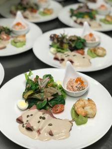 a group of plates of food on a table at Gasthaus zum Hirsch Hotel - Restaurant in Weier +17 photos