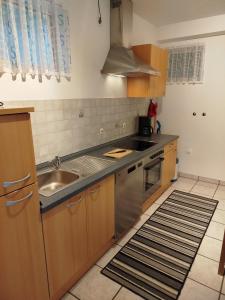 a kitchen with a sink and a counter top at Ferienwohnung Brigatt in Klotten