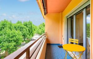 a yellow table and chair on a balcony with a view at Apto Jérica in Jérica +15 photos