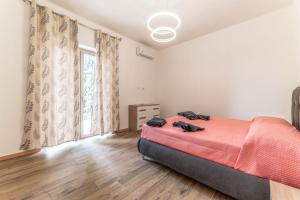 a bedroom with a bed and a large window at Chateau De La Rose in Fonte Nuova