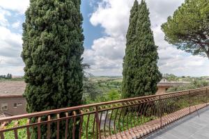 a group of three trees on a fence at Chateau De La Rose in Fonte Nuova