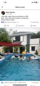 a group of people floating in a swimming pool at Casa Sandrine Resort in Malolos