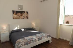 Postel nebo postele na pokoji v ubytování Ai Lattarini House