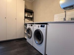 a washer and dryer in a laundry room at Hus Orsa in Orsa