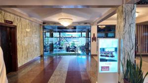 a lobby of a building with a glass door at The Luke Hotel - Roasters in Nairobi +80 photos