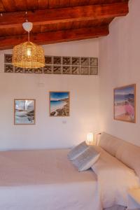 a bedroom with a large bed in a room at Le Gioie di Laura in Su Forti