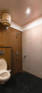 a bathroom with a toilet and a shower stall at Eden Resort By Live Inn in Lansdowne +41 photos