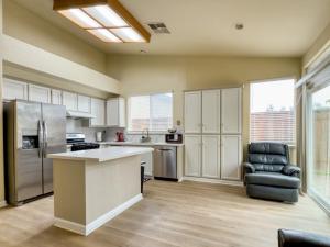 a kitchen with a counter and a chair in it at Oakley Bay Area Haven in Oakley