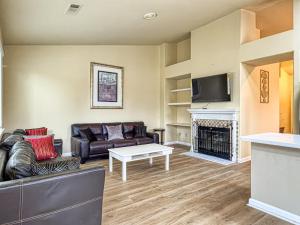 a living room with a couch and a fireplace at Oakley Bay Area Haven in Oakley