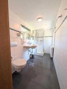 a bathroom with a toilet and a sink at Turmhütte in Lauterbach +36 photos