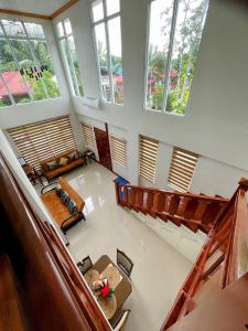 an overhead view of a living room with large windows at KRUEGERs Cottage in Sipalay