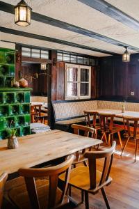 a dining room with wooden tables and chairs at Turmhütte in Lauterbach