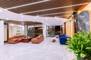 a lobby with couches and chairs and plants at Kim Long Hotel Lao Cai - Near Hekou Border Gate in Lao Cai