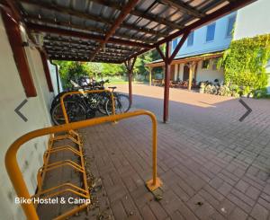 a group of bikes parked under a building at Bike Hostel&Camp in Przewóz +34 photos