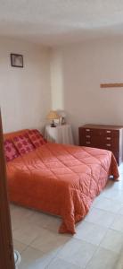a bedroom with a large bed and a table at Siroco Nau Algarve in Olhão +4 photos