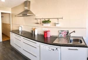 a kitchen with a sink and a counter top at Piso de Verano en El Tiemblo in El Tiemblo