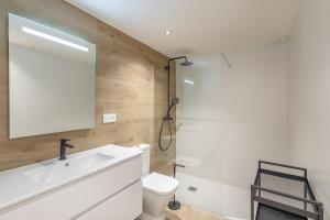 a bathroom with a white sink and a toilet at Be1960 segon in Bagá +22 photos