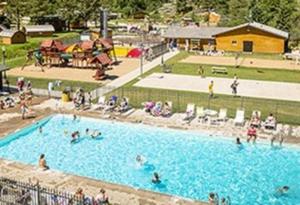 a group of people in a swimming pool at Lodge at Palmer Gulch in Hill City