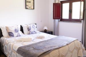 a bedroom with a large bed in a room at Geres parque in Geres +14 photos