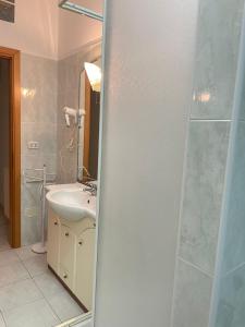 a bathroom with a sink and a shower at Casa Kate in Scanzano