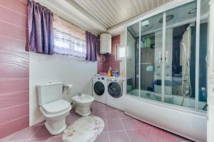 a pink bathroom with a toilet and a shower at Studio Apartments S in Dobra Voda +53 photos