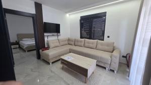 a living room with a couch and a coffee table at Vile Relax in Donji Štoj +65 photos