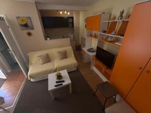 a small living room with a couch and a table at Apartment Tancabel in Lovran