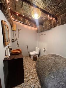 a bathroom with a bed and a toilet in it at Sunset Sea View House Large Terrace 2BR in Ban Nok