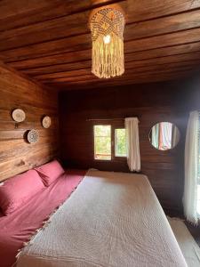 a large bed in a room with a chandelier at Sunset Sea View House Large Terrace 2BR in Ban Nok