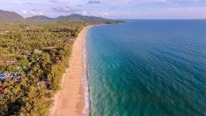 an aerial view of a beach and the ocean at Beachfront! 4 Bedrooms - Malee Beach Villa E6 in Phra Ae beach