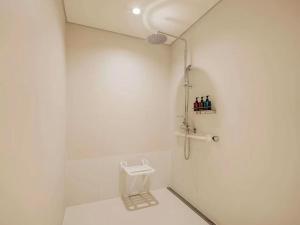 a bathroom with a toilet and a shower at Hotel Daira Suite Near IGI Airport Delhi in New Delhi +26 photos