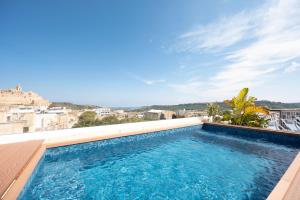 a swimming pool on the roof of a building at Townhouse17 Boutique Bed & Breakfast in Victoria