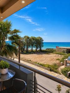 a balcony with a view of the ocean at Kleanthi Studios in Chania
