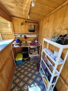 an inside view of a small room with a sink at Private Luxury Glamping surrounded by wildlife in Pembrokeshire