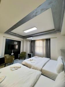 a hotel room with two beds and a desk at Retro Boutique in Istanbul