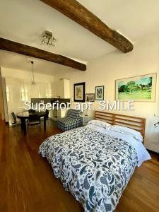 a bedroom with a large bed and a table at La Scala Vernazza CinqueTerre in Vernazza