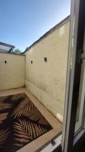 a view of a patio with a wall at Le Palais Des Marins in Châteauroux