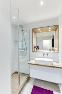 a bathroom with a sink and a shower at Appartement Centre Cholet in Cholet